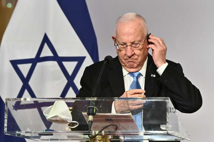 以色列总统鲁文·里夫林在3月17日的新闻发布会上。 以色列是抗Covid疫苗接种的先驱，它是一项法律行动的主题，该行动既脆弱又对媒体友好。